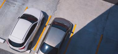 Two cars in a parking lot